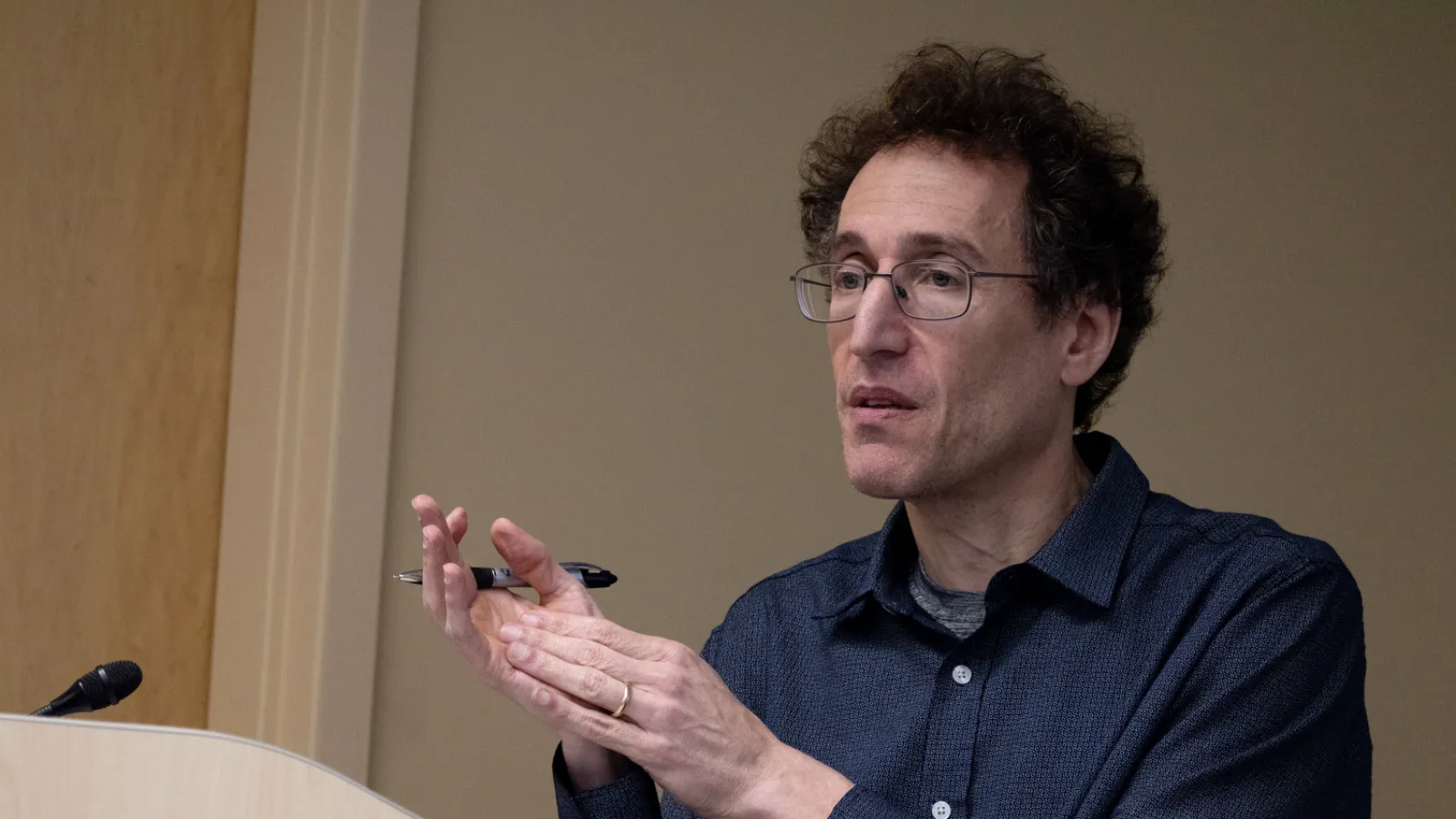 Jamie Druckman speaks at a lectern